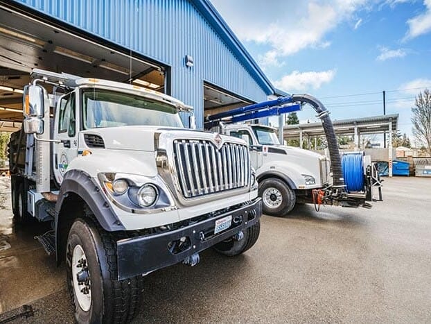 two industrial trucks in the bay of a warehouse