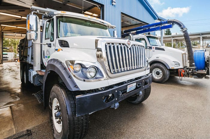 two industrial trucks in the bay of a warehouse